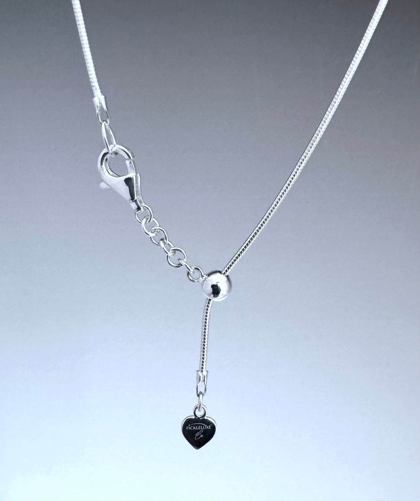silver snake chain with bead slide and heart charm tag