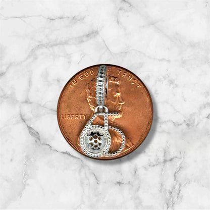 silver 65 charm with pickleball, copper penny
