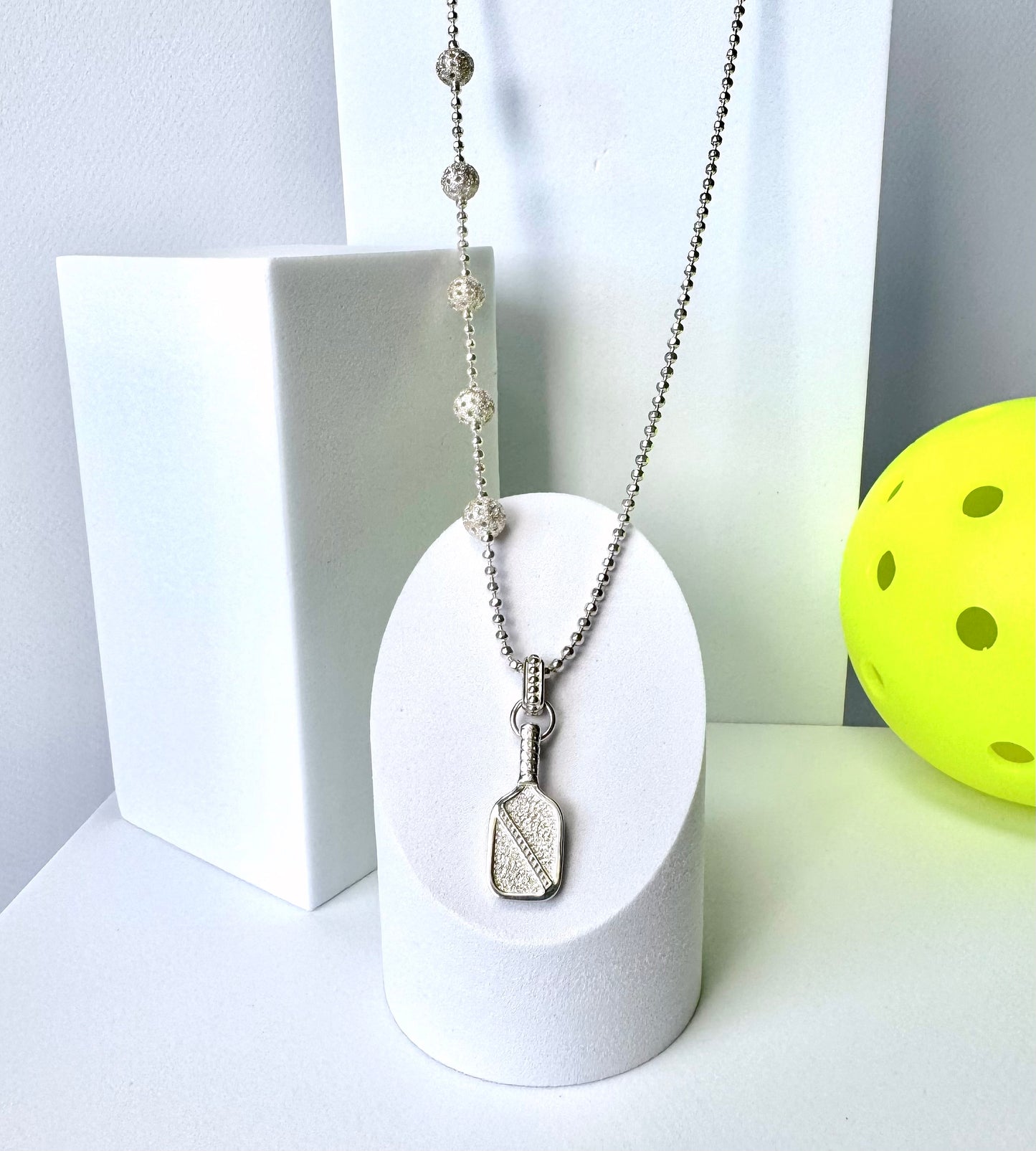 asymmetric pickleball necklace with paddle charm and balls, sterling silver