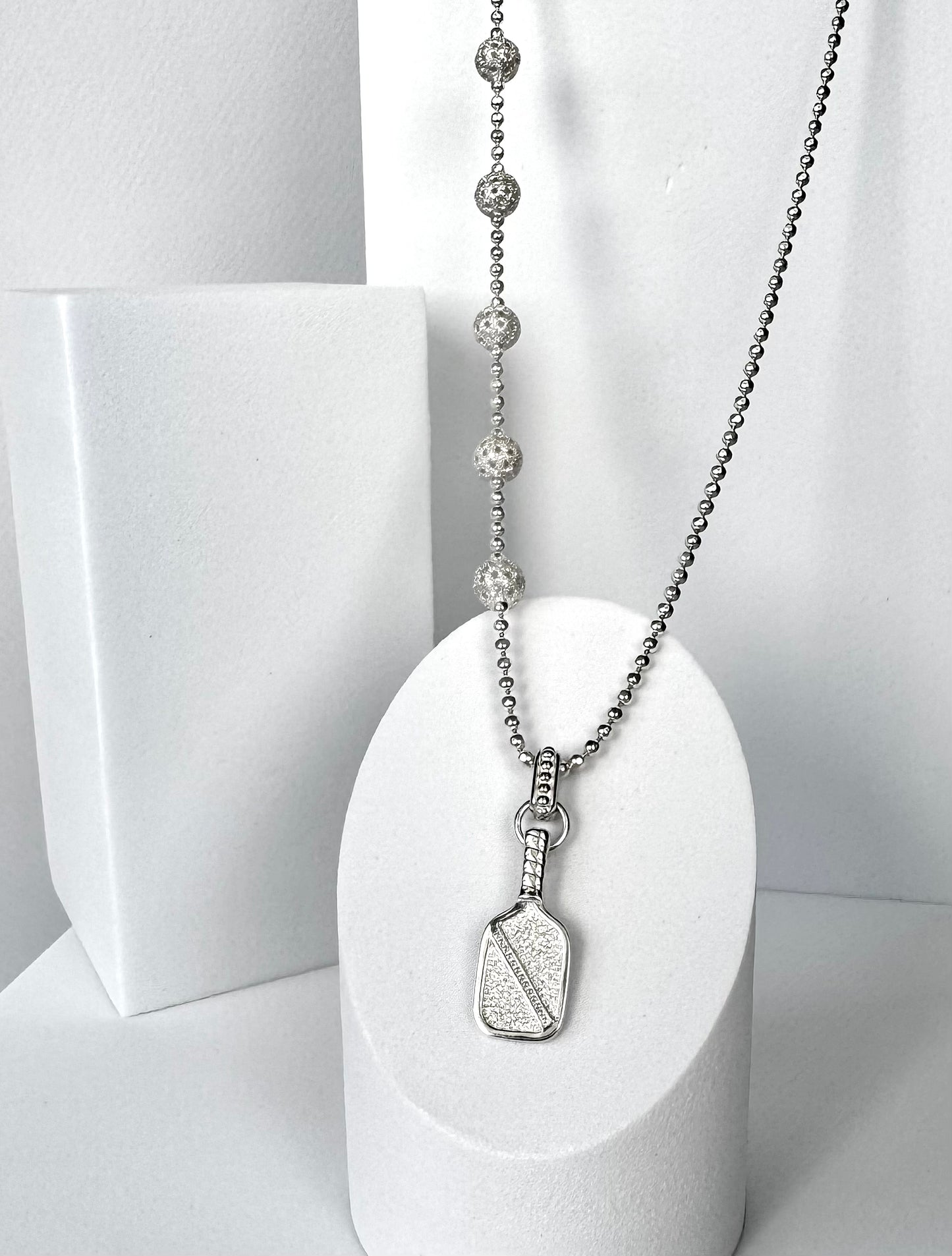 asymmetric pickleball necklace with paddle and ball charm, silver bead chain