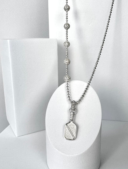 asymmetric pickleball necklace with paddle and ball charm, silver bead chain