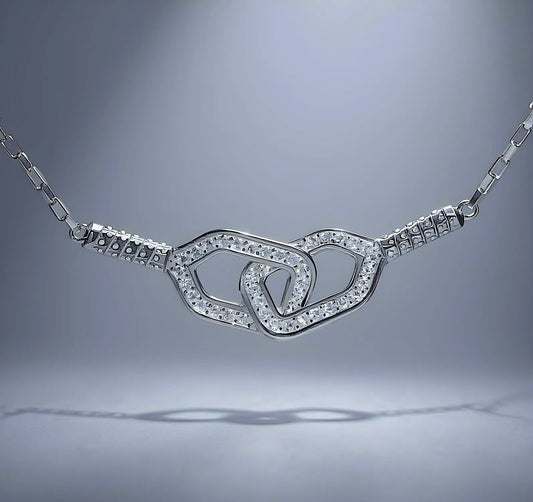 Silver necklace with double pickleball paddles pendant on a gray background