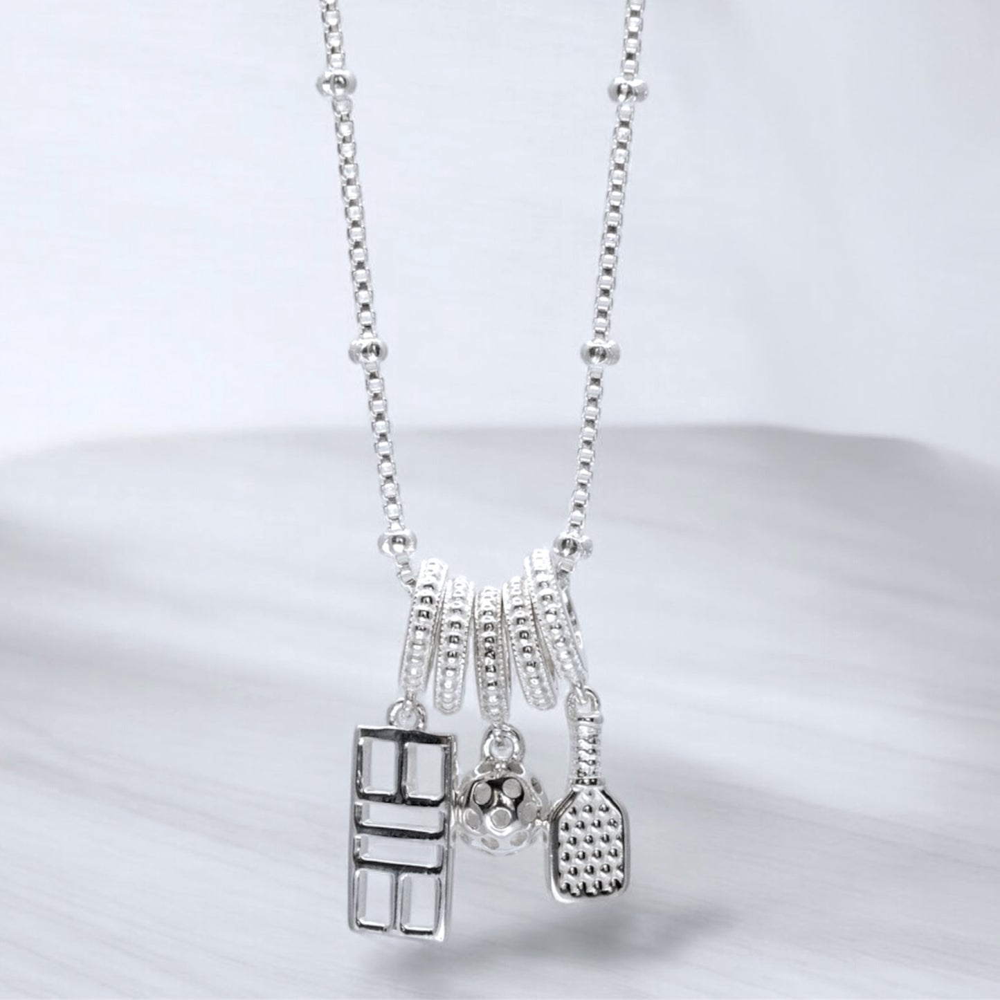 pickleball charm necklace with paddle, ball, court, sterling silver