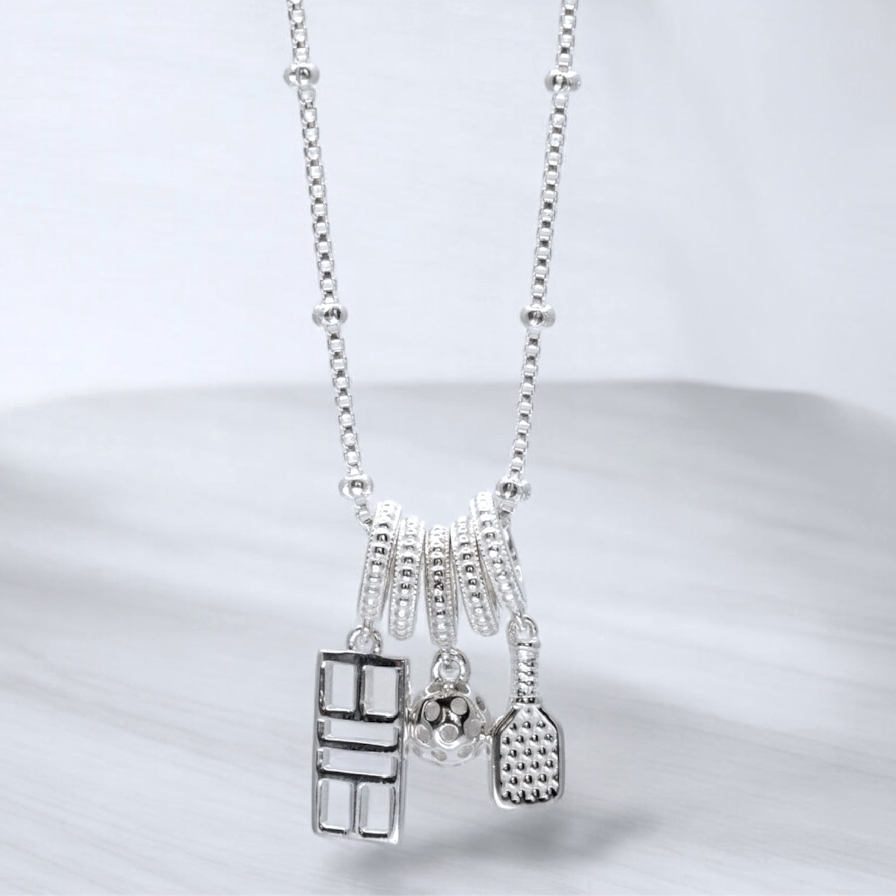 pickleball charm necklace with paddle, ball, court, sterling silver