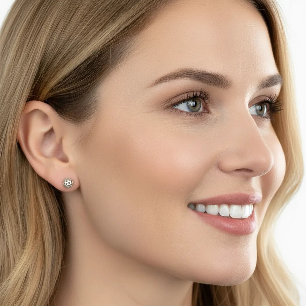 Close-up of a woman wearing a pickleball stud post earring.