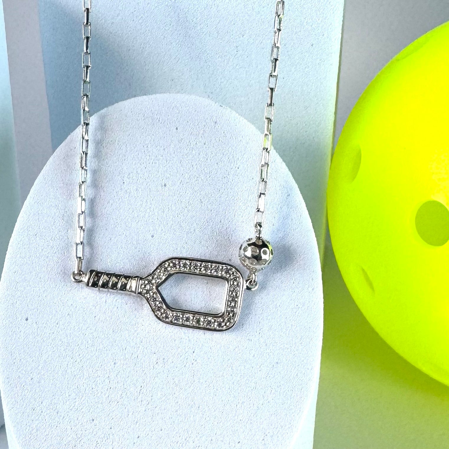 pickleball essentials necklace with paddle and ball charm, silver box chain