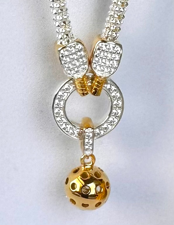 pickleball necklace with gold paddles and gold ball, sterling silver and cubic zirconia