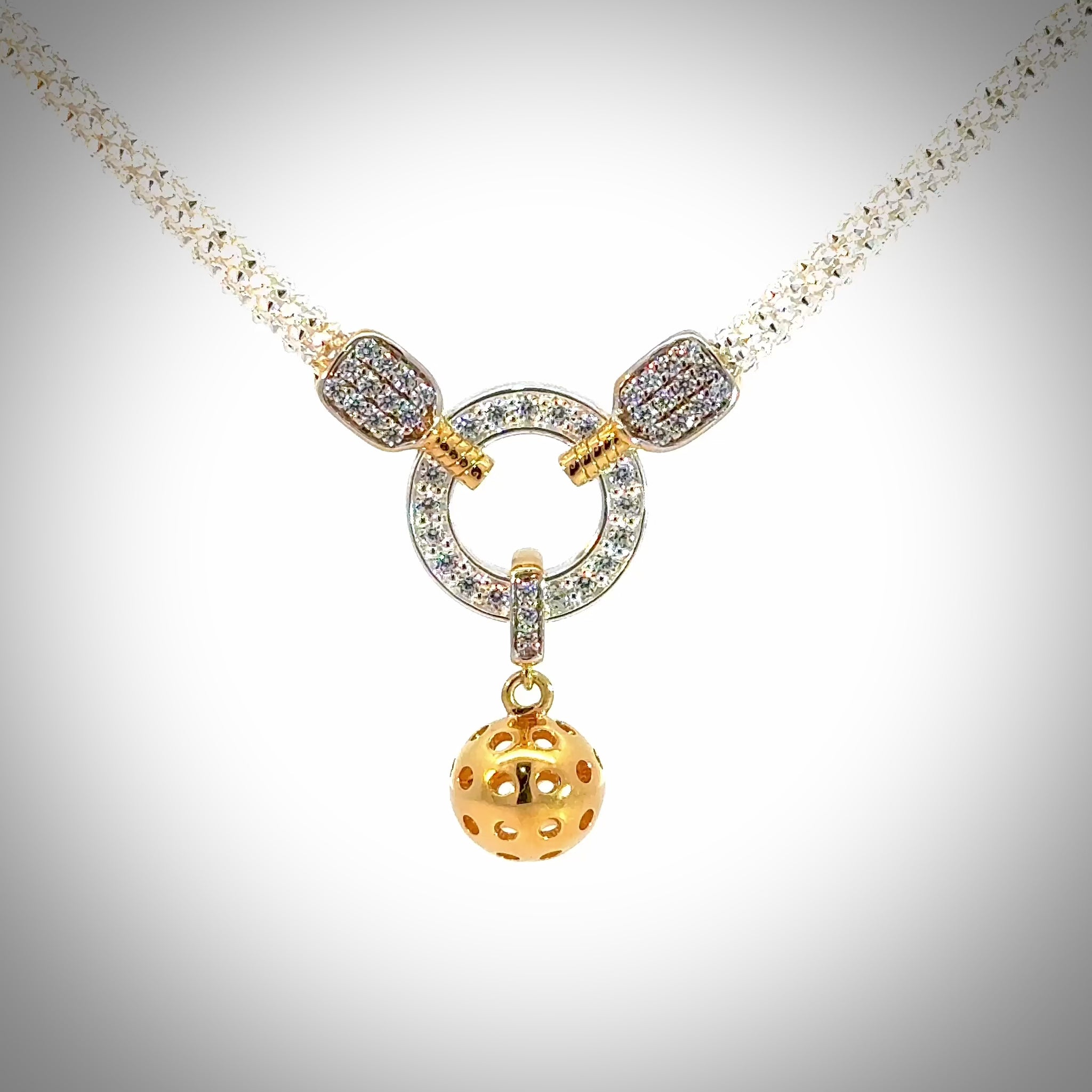 pickleball necklace with two paddles and ball, silver, gold, cubic zirconia