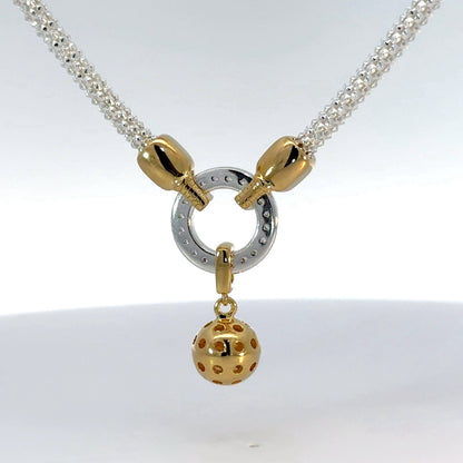 Pickleball necklace with two gold paddles, cubic zirconia, gold ball and silver chain