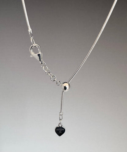 silver snake chain with bead slide and heart charm tag